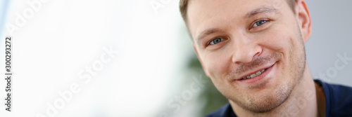 Handsome and Smiling Male Face Closeup Portrait