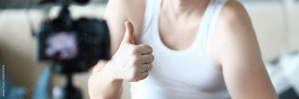 Happy Sportsman with Dumbbell Showing Thumb Up Happy Sportsman with Dumbbell Showing Thumb Up