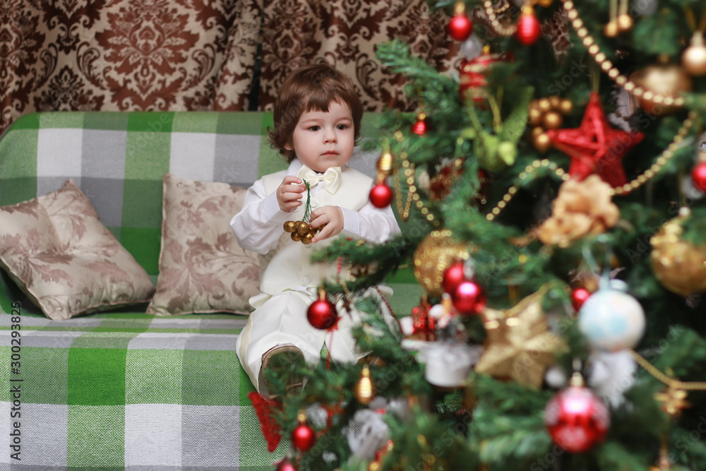 child decorate the Christmas tree toy