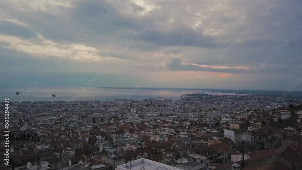 Drone flies above old town of Thessaloniki on sunset hour with overcast weather, Greece Drone flies above old town of Thessaloniki on sunset hour with overcast weather, Greece