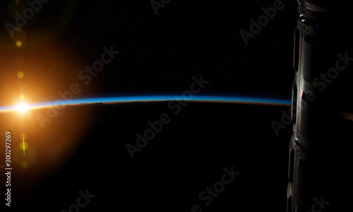 Fototapeta Naklejka Na Ścianę i Meble -  View of planet Earth horizon from a space station window during a sunrise 3D rendering elements of this image furnished by NASA