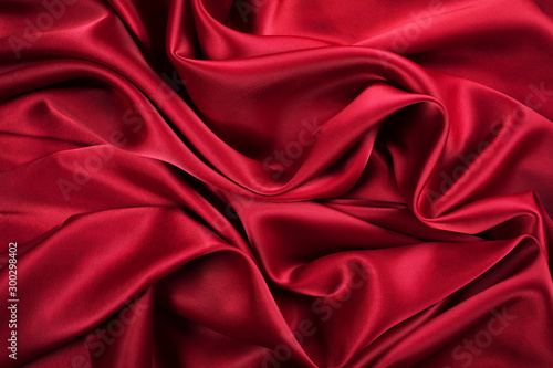 Abstract beautiful deep red textile folded waves. Fashion concept