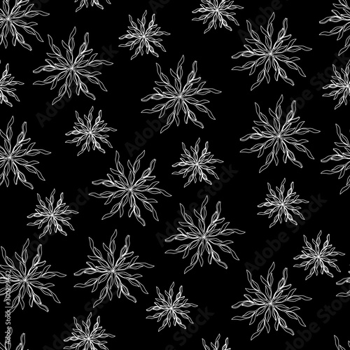 Black and white winter pattern with snowflakes against a dark background. Seamless abstract pattern for decoration of fabric  paper.