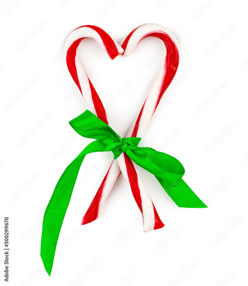 Two candy canes isolated on white background Two candy canes isolated on white background