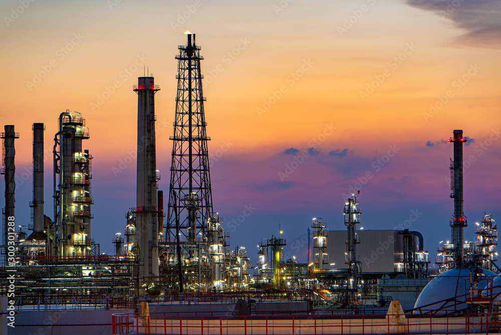 Oil and gas refinery plant area at sunset