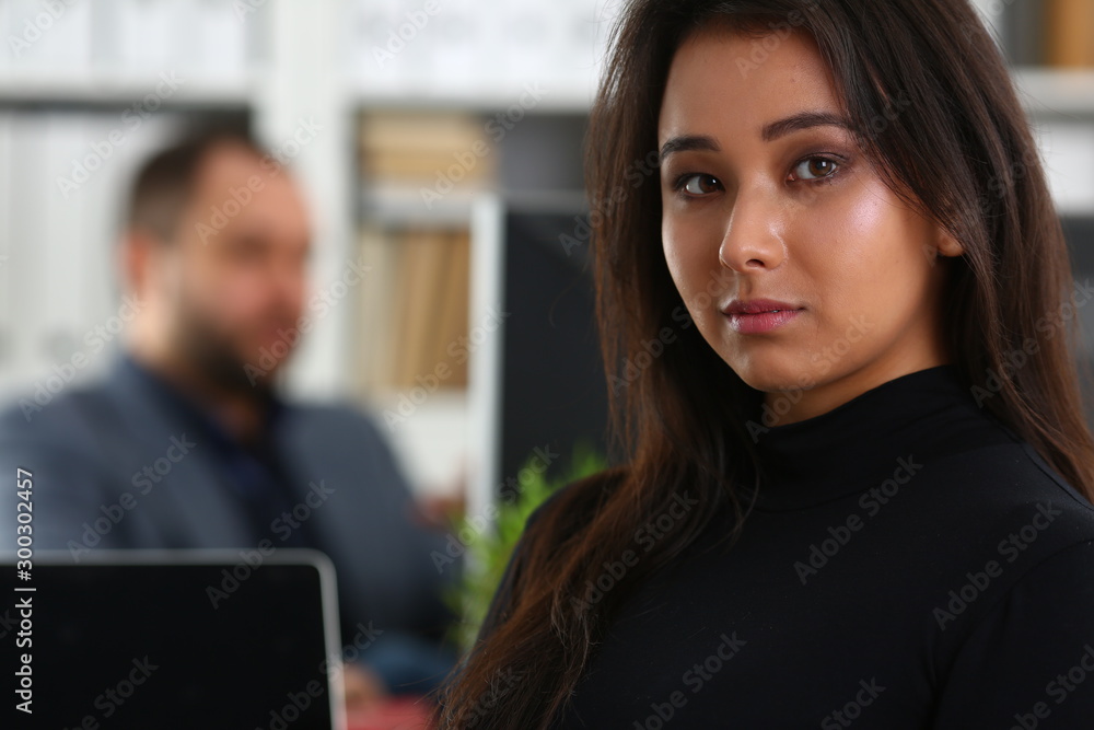 young beautiful brunette woman sit at table in office in cabinet of her boss young beautiful brunette woman sit at table in office in cabinet of her boss