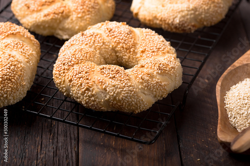 Seeds bagel stack bakery background. Homemade tasty bagel bun, white & black sesame, flax seeds, chia. Healthy breakfast food bakery background. German turkish bread brunch bagel - bakery background