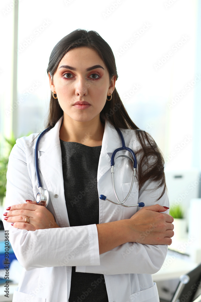 Beautiful smiling female doctor at workplace portrait Beautiful smiling female doctor at workplace portrait