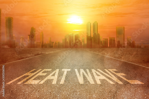 Tableau sur toile Heatwave text on the street on the city with the glowing sun background
