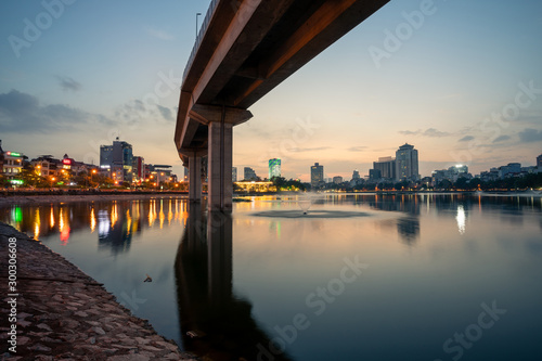Hanoi cityscape at twilight at Hoang Cau lake  with the Cat Linh-Ha Dong elevated railroad