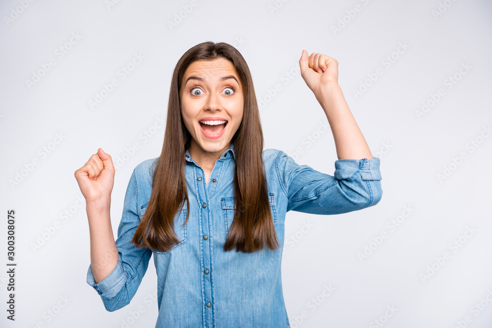 Close-up portrait of her she nice attractive lovely amazed glad excited cheerful cheery positive girl fan holding fists having fun rejoicing isolated over light white color background Close-up portrait of her she nice attractive lovely amazed glad excited cheerful cheery positive girl fan holding fists having fun rejoicing isolated over light white color background