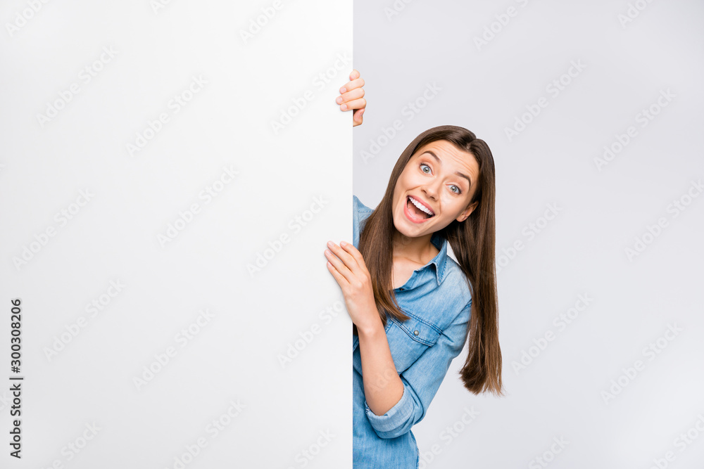 Portrait of her she nice attractive lovely pretty glad excited cheerful cheery positive girl demonstrating copy space board ad isolated over light white color background Portrait of her she nice attractive lovely pretty glad excited cheerful cheery positive girl demonstrating copy space board ad isolated over light white color background