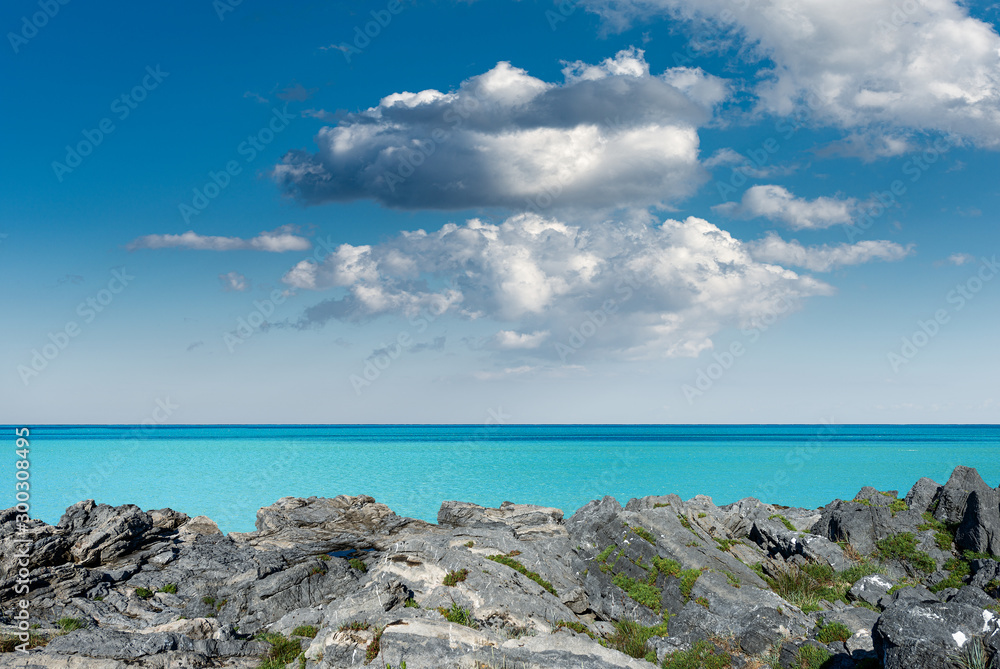Cliff with turquoise seascape and blue sky with clouds, Mediterranean Sea, Italy, Europe Cliff with turquoise seascape and blue sky with clouds, Mediterranean Sea, Italy, Europe