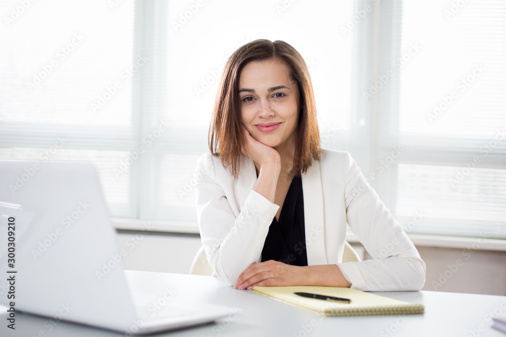 Young beautiful businesswoman with laptop Young beautiful businesswoman with laptop