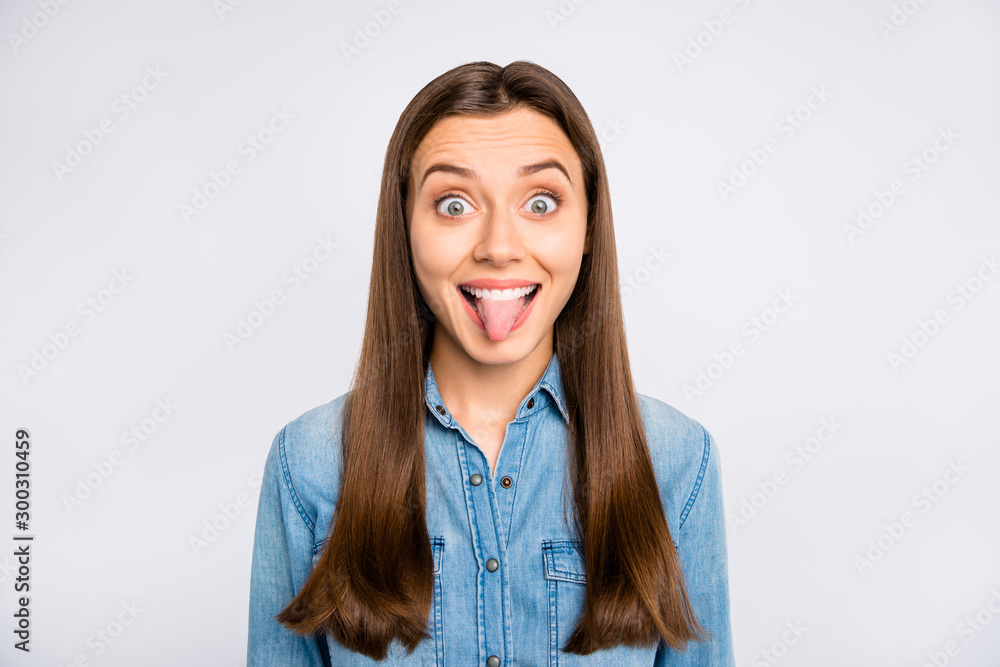 Obraz premium Portrait of excited funky funny feel rejoice on spring weekends show her tongue make friends laugh wear casual style clothing isolated over white color background