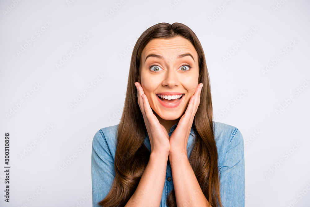 Close up photo of astonished funky funny youth girl hear wonderful novelty  about bargain touch palms face scream wow omg enjoy feel rejoice wear  casual style clothes isolated white color background Photos