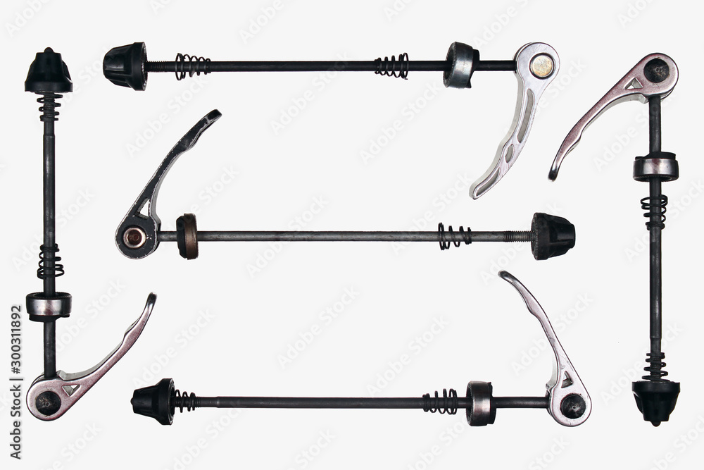 Old bicycle quick release axles, isolated against white background Old bicycle quick release axles, isolated against white background