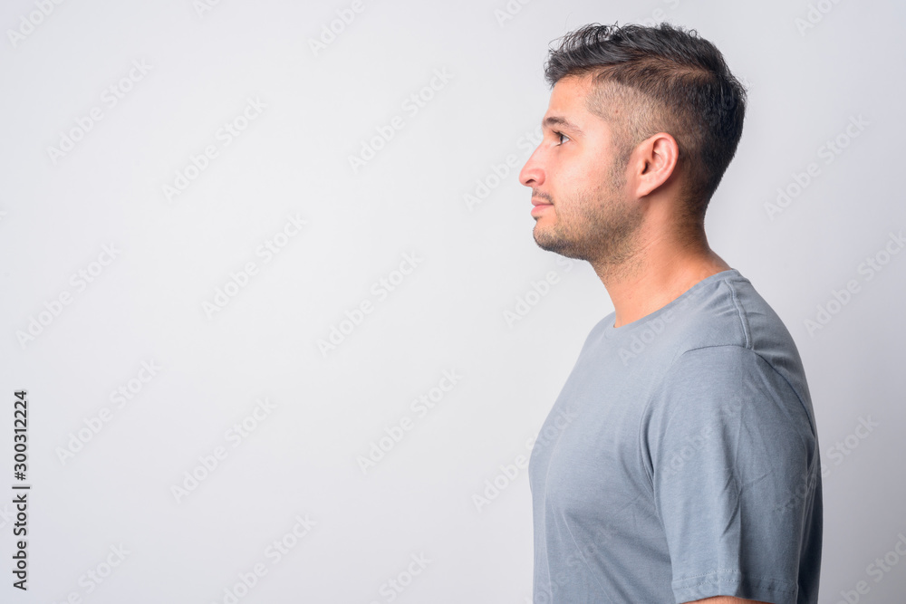 Closeup profile view of young handsome Persian man Closeup profile view of young handsome Persian man