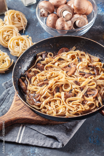 Tagliatelle pasta with champignion mushrooms photo