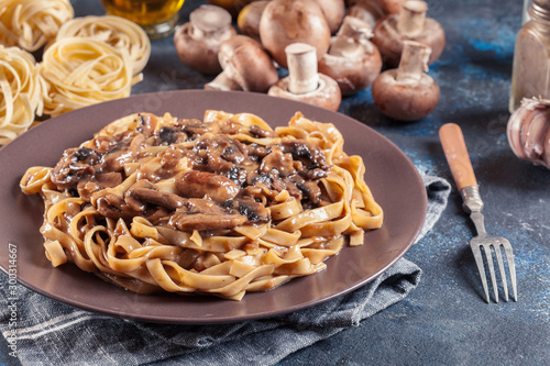 Tagliatelle pasta with champignion mushrooms photo