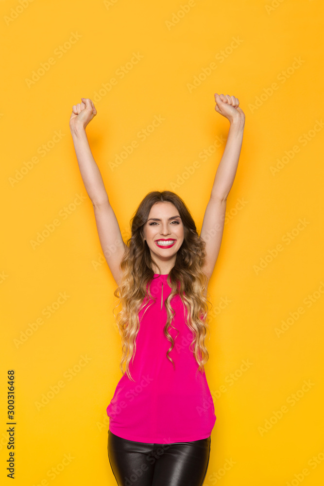 Happy Young Woman Is Smiling With Arms Raised Happy Young Woman Is Smiling With Arms Raised