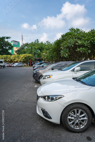 Cars in the parking lot in row with blue sky © Hanoi Photography
