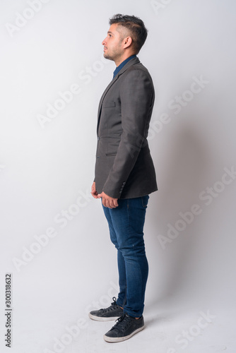 Full body shot profile view of Persian businessman in suit