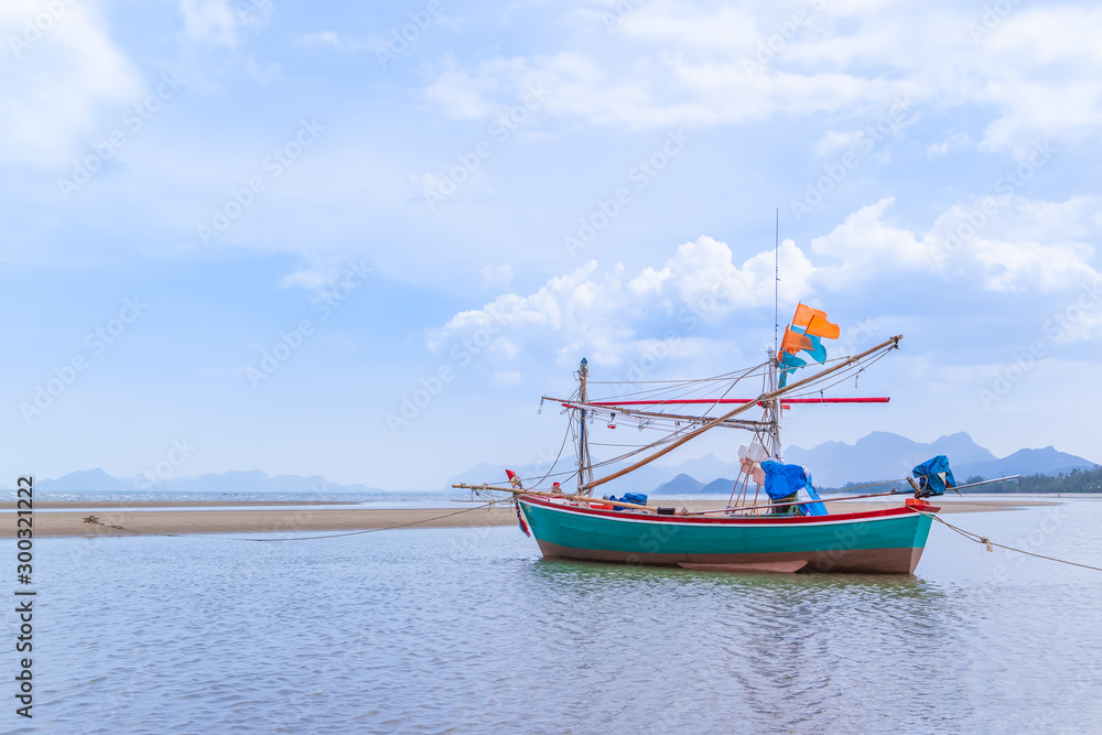 Fishing boat on beach near fisherman village at Khao Kalok mountain, near Hua Hin, Thailand