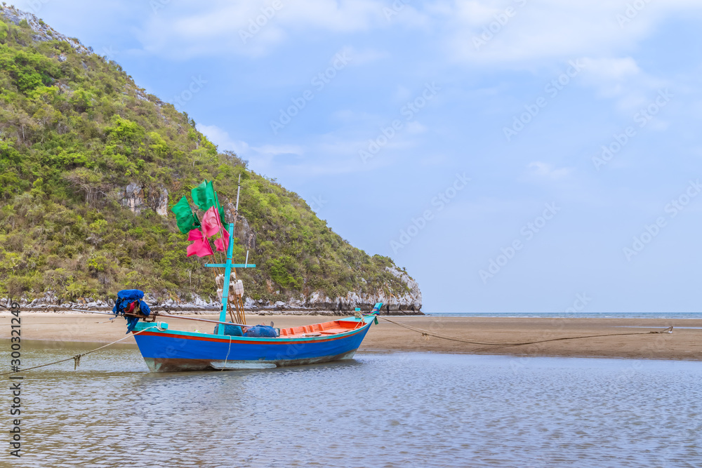 Fishing boat on beach near fisherman village at Khao Kalok mountain, near Hua Hin, Thailand