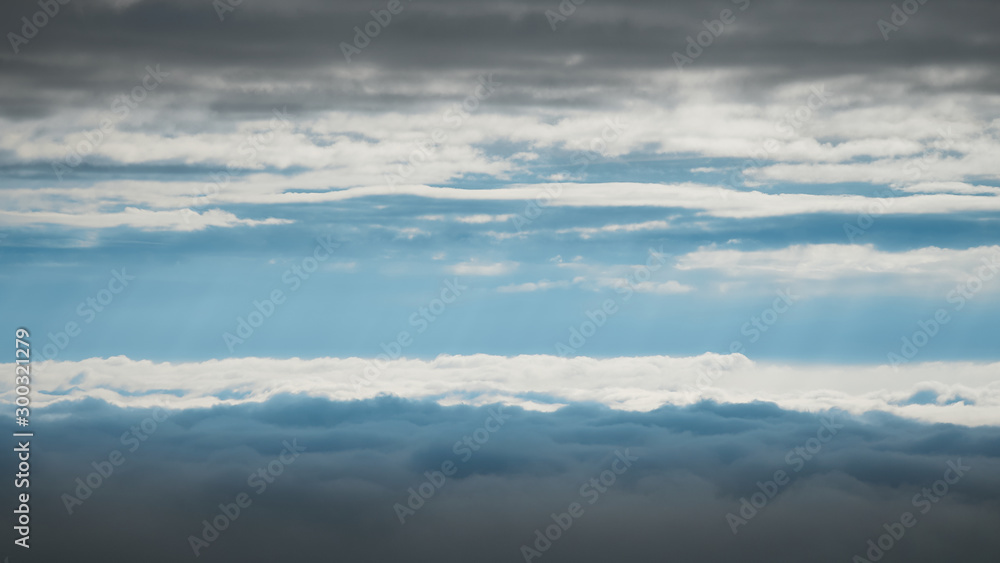 Photograph between the high and low clouds