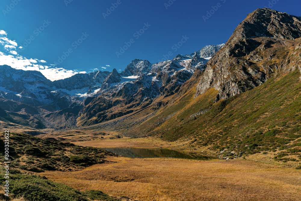 Fototapeta premium Panoramic view of the alpine Seebersee lake with the high rising mountains of the Texelgruppe in the background