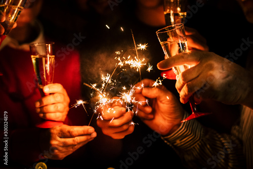 Canvastavla close up of sparklers and glass of champagne together celebrating the new year o