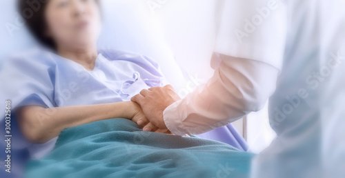 Elderly patient care concept  Asian doctor is taking care elderly patient woman in hospital. © Anchalee