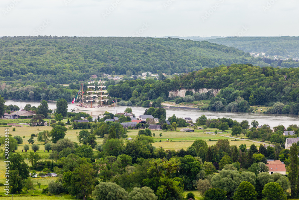 France, Normandy, arrival in the rain of the 2019 Armada tall ships, Cuauhtemoc sailing on the Seine River among lush green fields, Seine River, Normandy