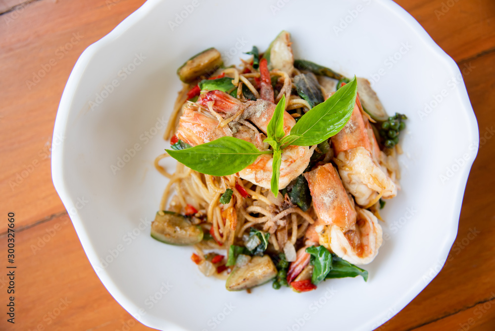 Spaghetti with spicy shrimp on white dish Spaghetti with spicy shrimp on white dish