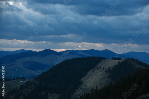 spring evening in the mountains with blue clouds © Andrii