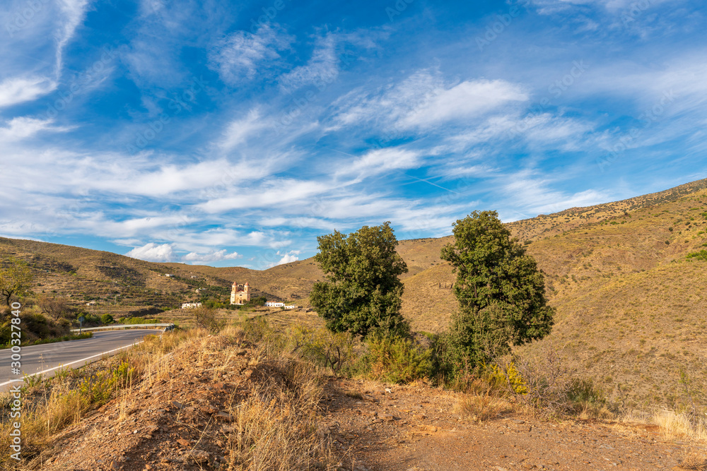 Landscape of Sierra Nevada with the church of Tices (Spain)