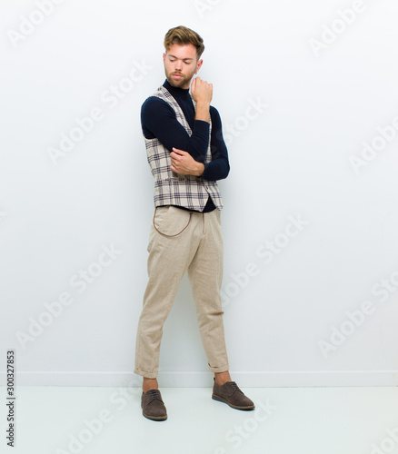 young man full body posing against white background photo