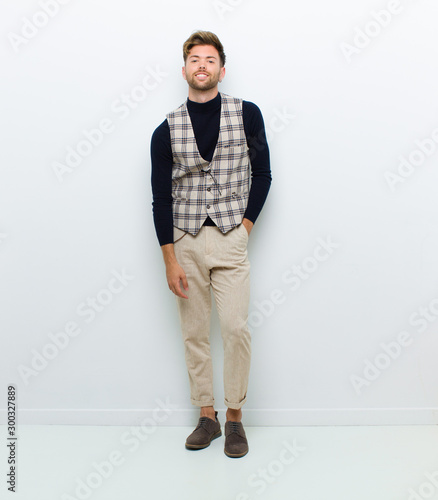 young man full body posing against white background photo