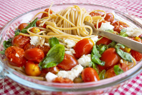 crudaiola pasta with cherry tomatoes basil and mozzarella