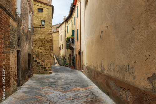 Amazing view with a narrow picturesque medieval street of old town of Pienza in Tuscany, Italy © Jess_Ivanova