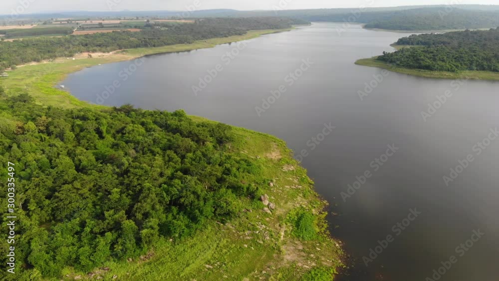 Drone shot aerial view scenic landscape of the big river and natural tropical forest Drone shot aerial view scenic landscape of the big river and natural tropical forest