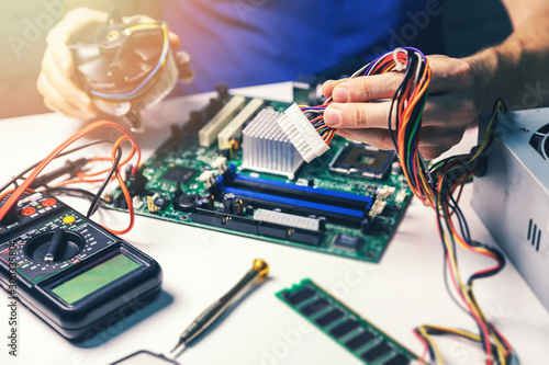 technician installing computer hardware components