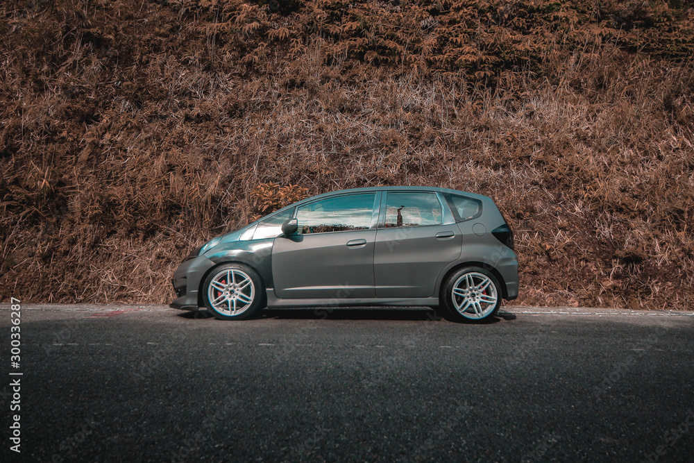 Fototapeta premium an automotive photo of a car with modification that is simple and also gives a fierce impression on a Honda brand type jazz fit