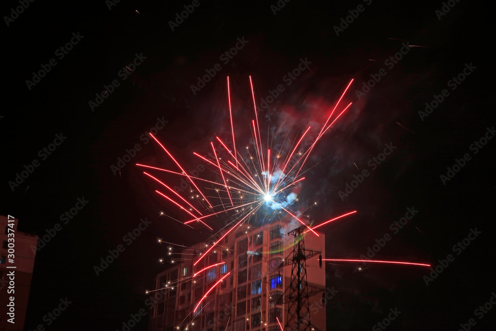 Obraz premium Fireworks over buildings