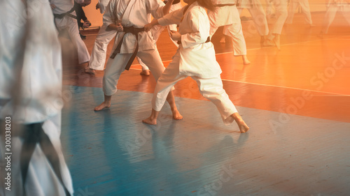 Kids training on karate-do. Banner with space for text. For web pages or advertising printing. Photo without faces.