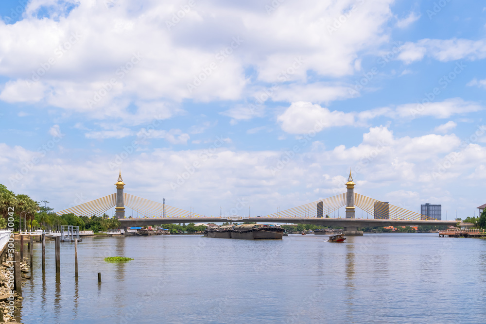 Maha Chesadabodindranusorn Bridge over Chao Phraya river in Nonthaburi, Thailand. Its structure is cable-stayed extradosed.