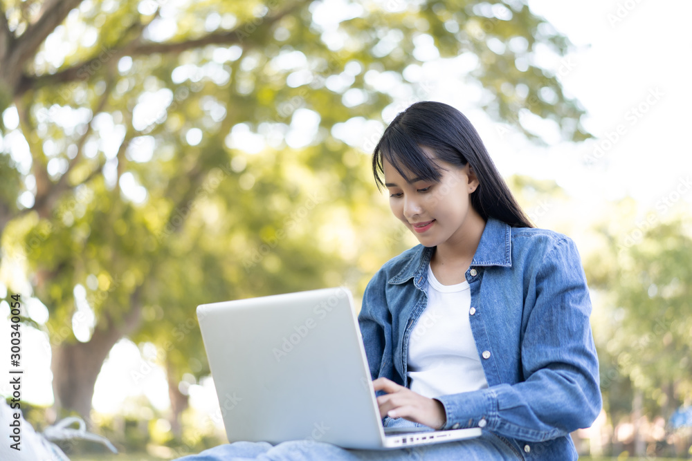 Education study abroad,Asian student girl with glasses look at laptop while doing homework making video call abroad using internet friend connection, business women use computer analysis finance data Education study abroad,Asian student girl with glasses look at laptop while doing homework making video call abroad using internet friend connection, business women use computer analysis finance data