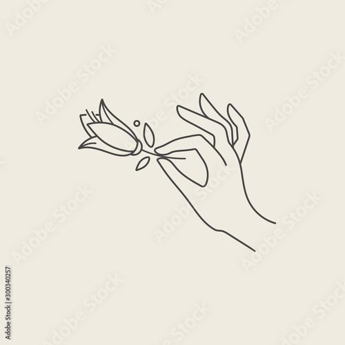 Vector design linear template logo or emblem - hand with tulip flowers. Abstract symbol for cosmetics and packaging or beauty products.