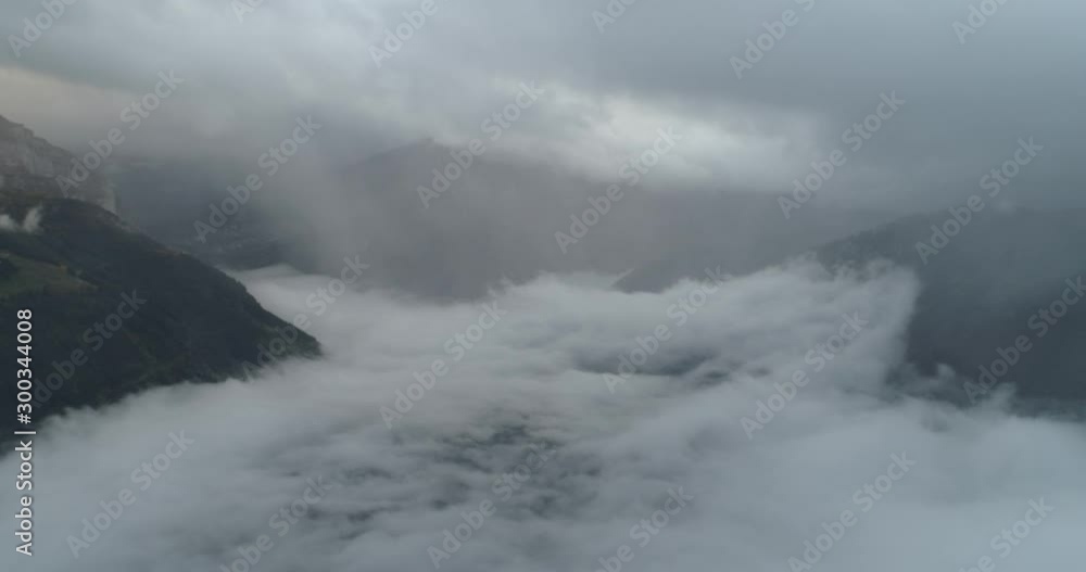 Flying over cloud in swiss montain in autumn Flying over cloud in swiss montain in autumn